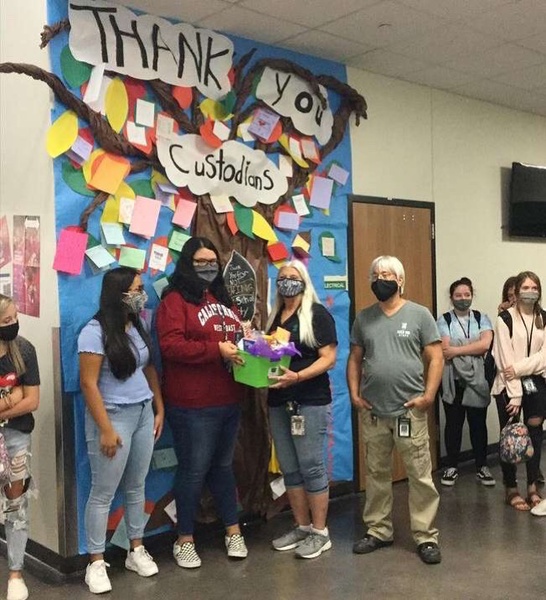 FCCLA presents head custodian Roxanne Hampton and the rest of the custodial staff with a gift for their hard work.