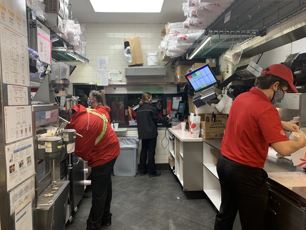 Teenage essential workers perform their duties at the Chic-fil-a in Lake Worth.