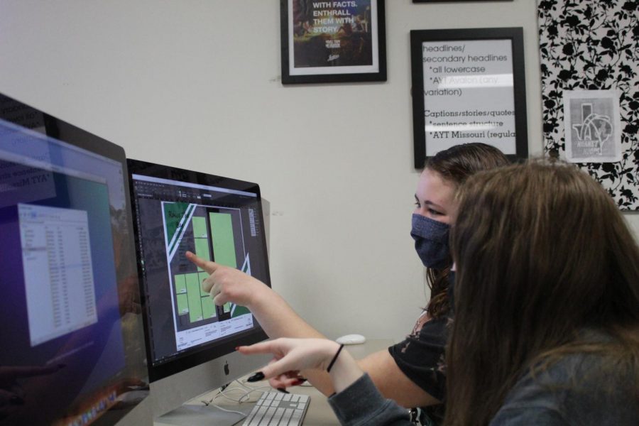 sophomores Jessie heath  and  work on the computer to complete the  yearbook.