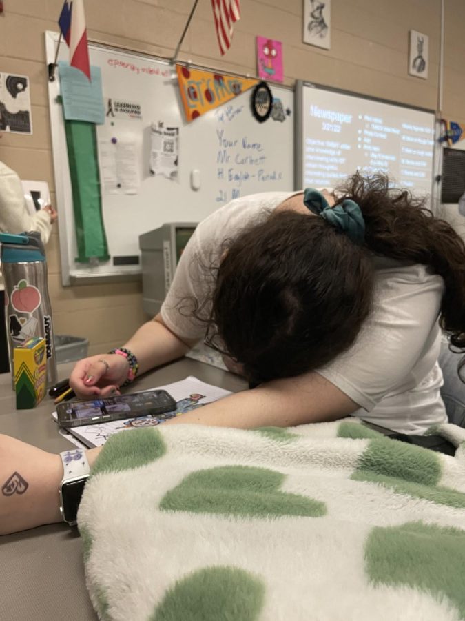 Senior Rya Walker sleeping on a desk in class.