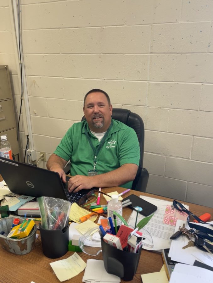 Coach+Overton+at+his+desk+getting+ready+for+class.