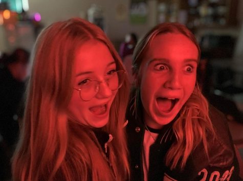 Sophomore Hanna Goodrich (left) and junior Daytona Gravlin watch a scary movie together.