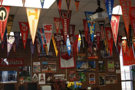 A photo of the college flags in Ms. Sturatts room.