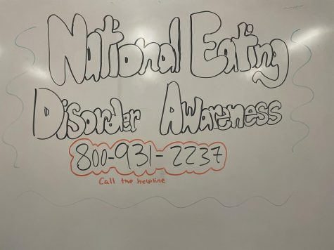National Eating Disorder Awareness with the Eating Disorder Helpline is written on a whiteboard.