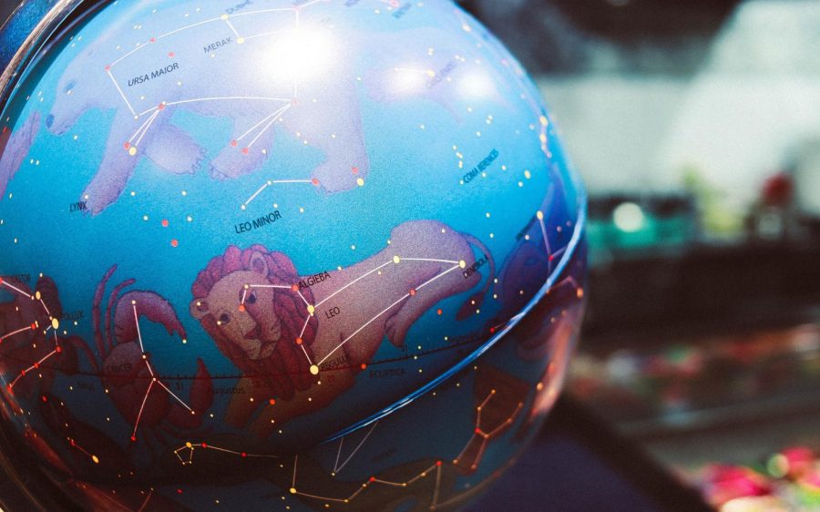 Constellations are seen on a globe with zodiac signs. https://unsplash.com/photos/DFrlRyLhCOQ
