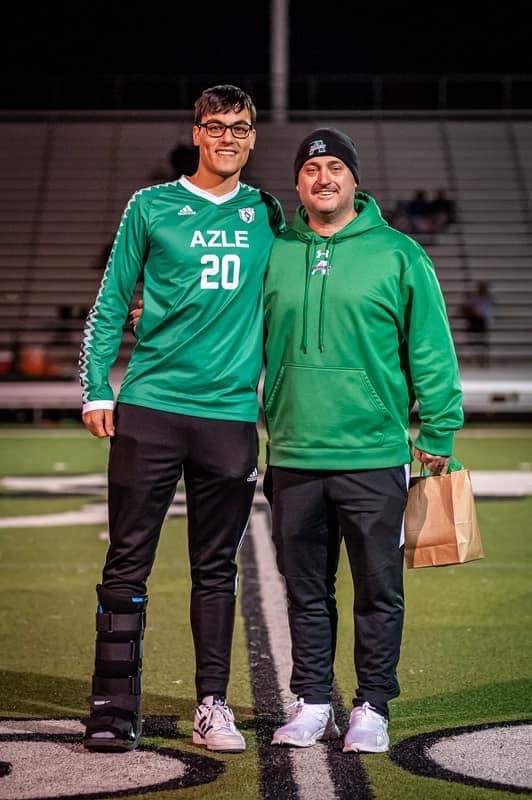 Junior Johannes Heid and Coach Jason Vines at the teach appreciation ceremony for soccer