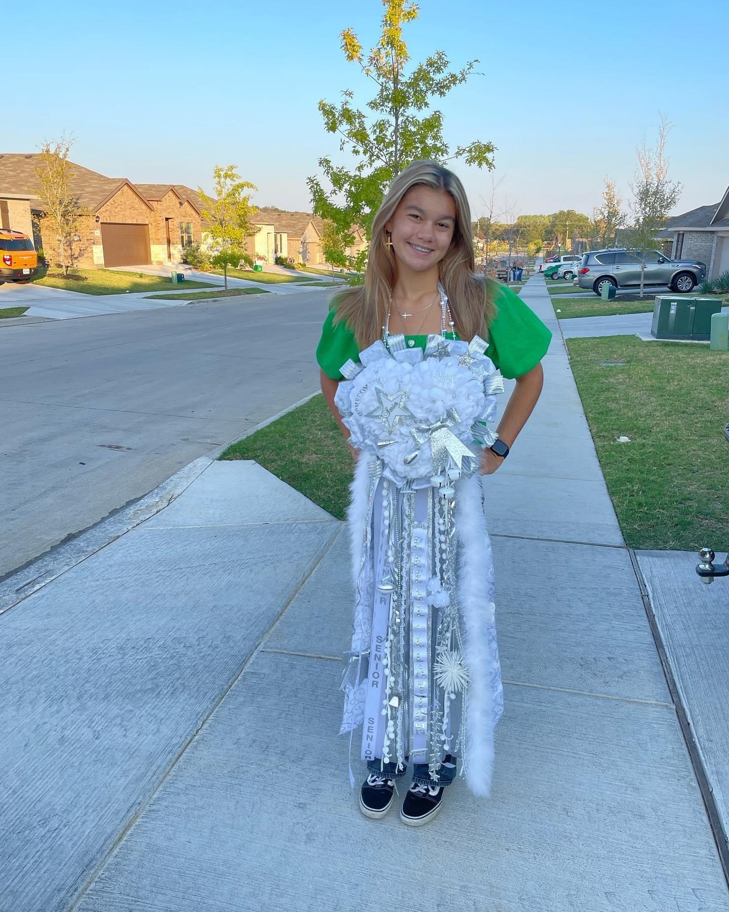 Senior Reese Hughes shows off her homecoming mum.