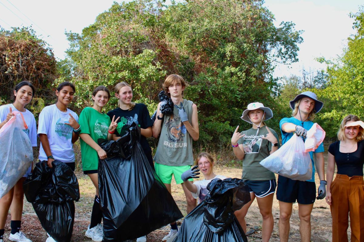 S.A.V.E. recently spent time picking up trash and cleaning the nature trail
behind the high school.