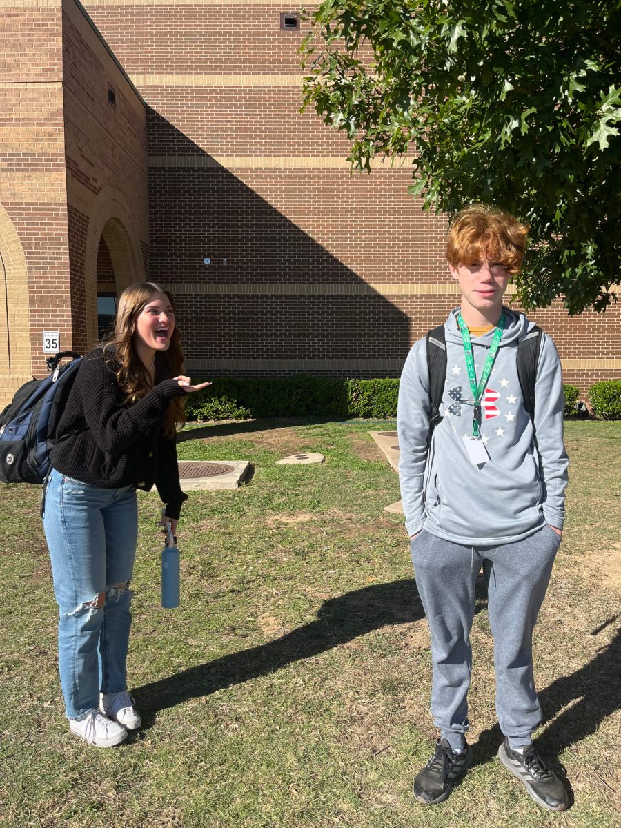Junior Ella Freimuth laughs and points at freshman Nathan Dyck