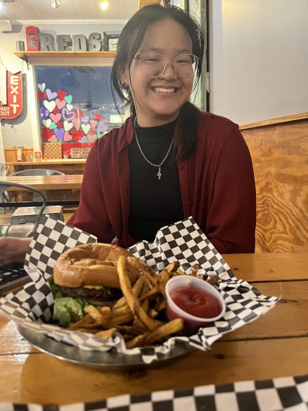 Junior Nova Wang enjoys a Reds burger.
