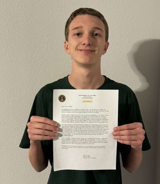 Senior Jacob Johnson with his acceptance to the Army University.