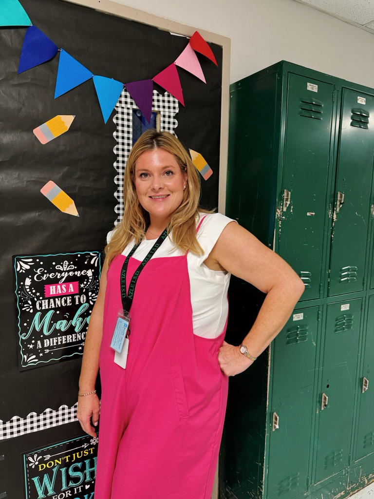 Mrs. Harman in front of her classroom