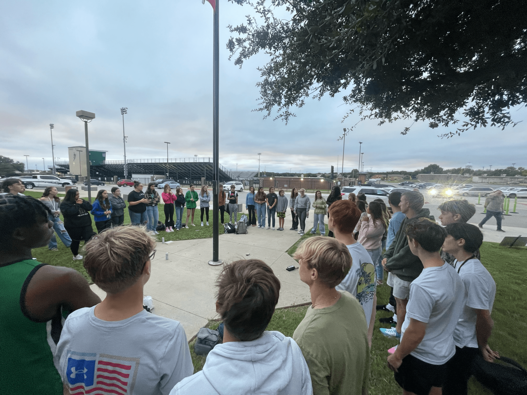 AHS students gather around the flag pole for the prayer rally on September 25, National Student Prayer Day for See You at the Pole. Photo courtesy of coach Lisa Helm.