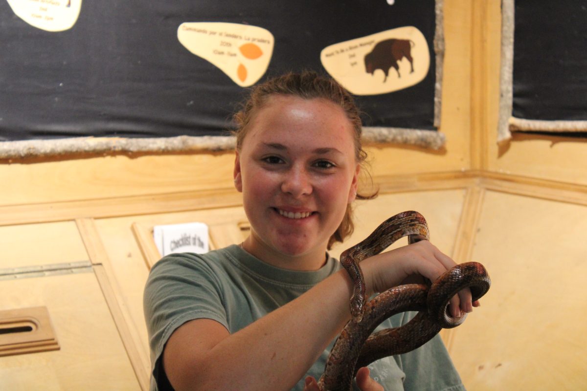 Junior Aspen Castaneda poses with a snake at the Fort Worth Nature Center