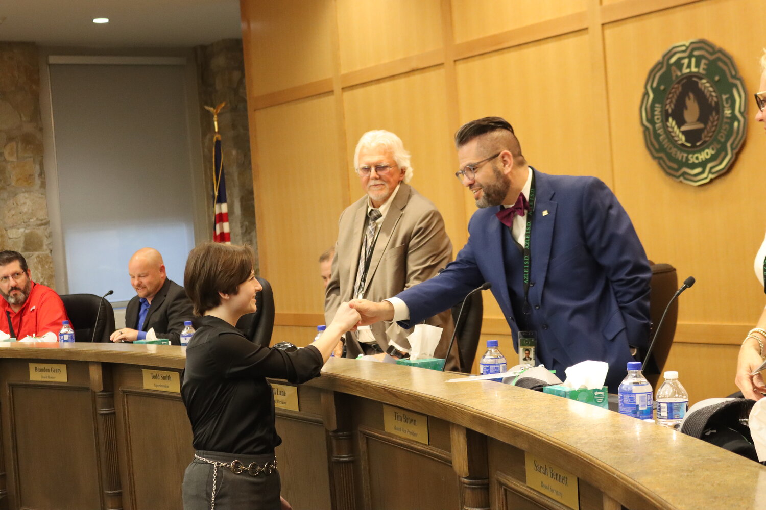 Senior Katalina Brunetti shaking hands with Vice President of Azle ISD board, Tim Brown, at the school board meeting that recognized them.