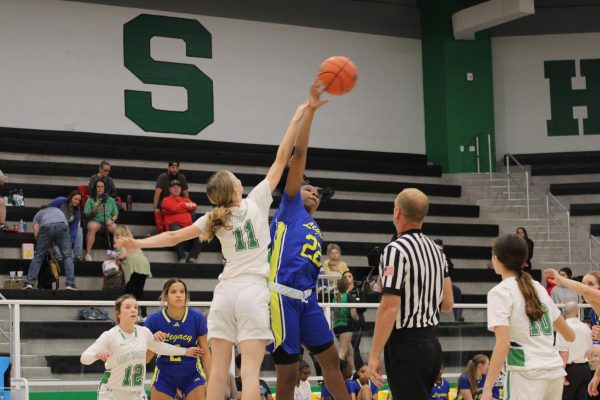 Junior forward Keagan Stuart tips off the game
versus Witchita Falls Legacy.