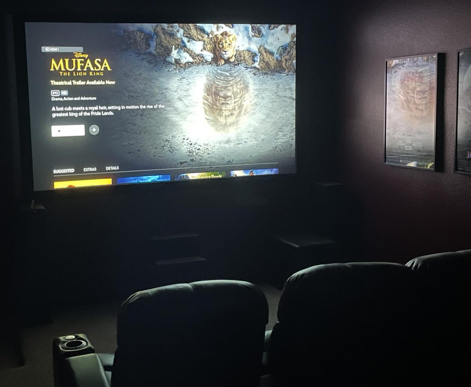 Mufasa the movie on screen in a home theater.