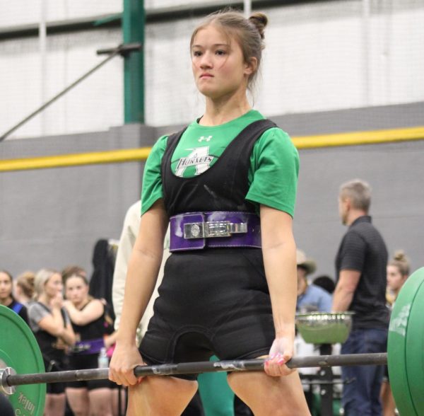 Senior Cooper Yates performs a deadlift at one of Azle's home meets against Boswell, Aledo and others.