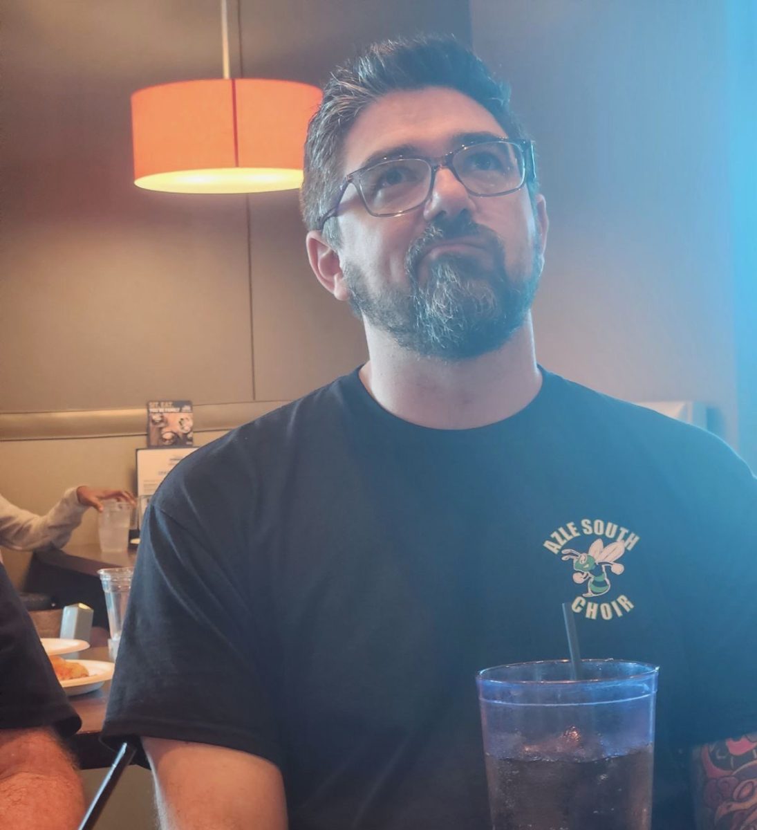 Mr. Moss ponders what to order for dinner. Courtesy of Riley Rahim.