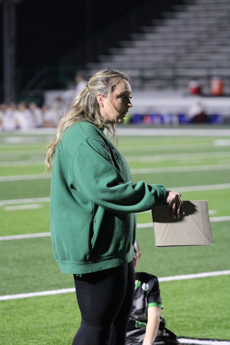 Coach Smith encourages her soccer players.