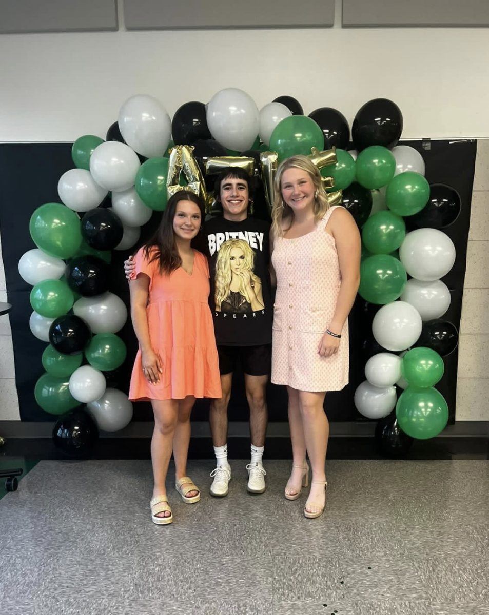 Junior Lance Smith poses with upcoming vice president Lainey Gentry and president Story Hilliard. Photo courtesy Addie Torgesen.
