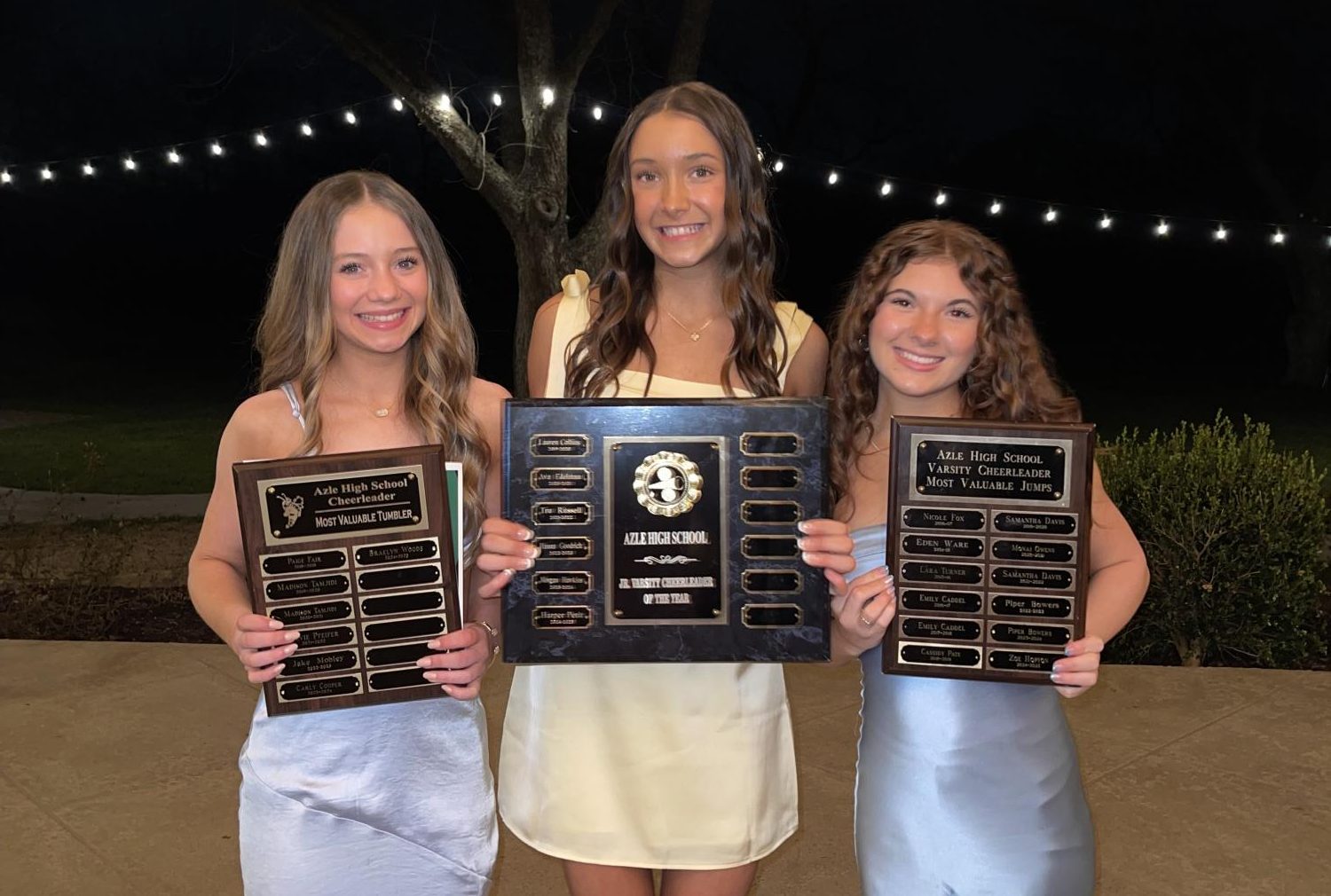 Freshmen Braelyn Woods and Harper Petit and sophomore Zoe Hopton at the cheer banquet. Photo courtesy Jackson Jinks.