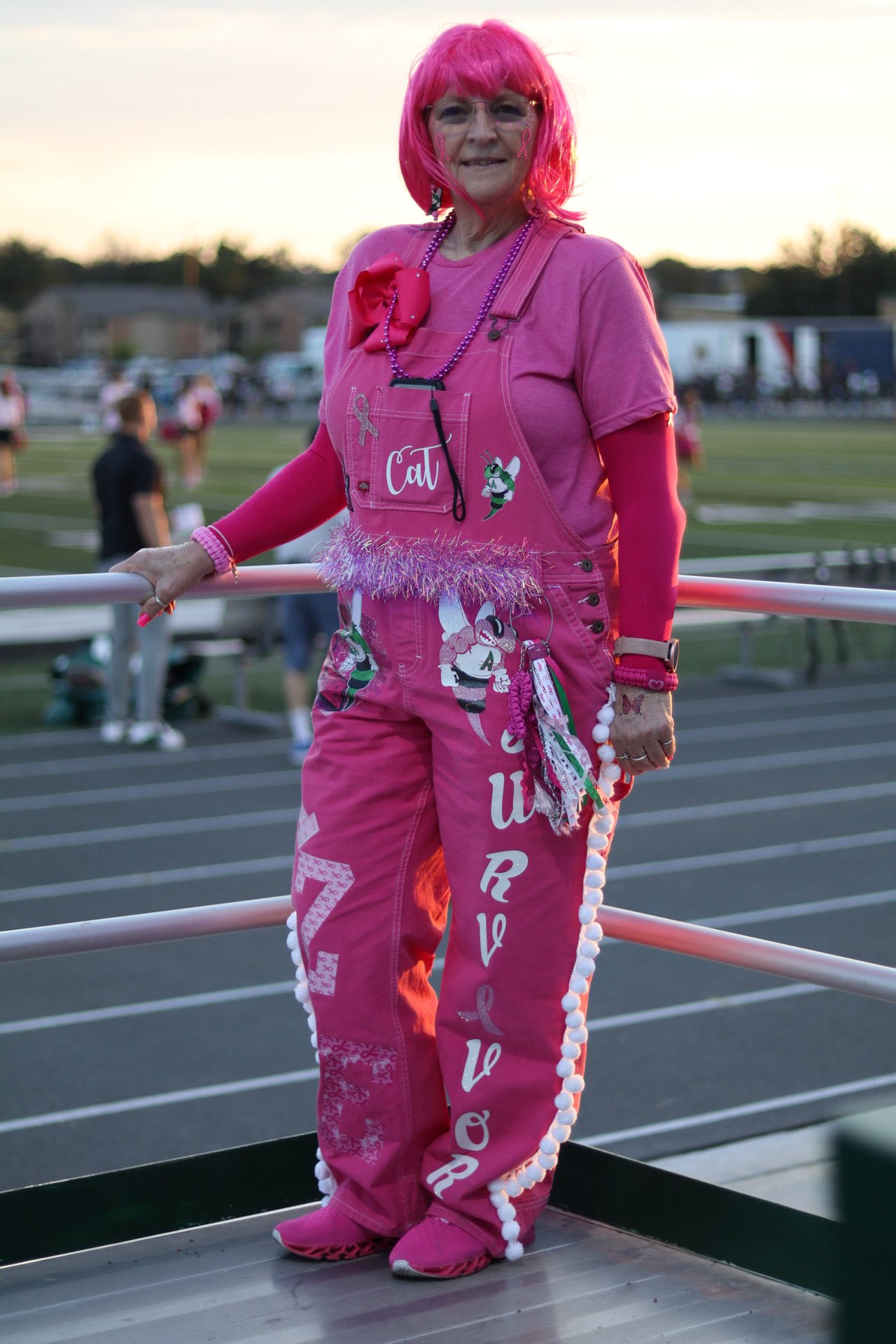 Cathy Markham, Breast Cancer Survivor and Special Education teacher decked out in pink during last year's Pink Out football game. Courtesy  of Cathy Markham.