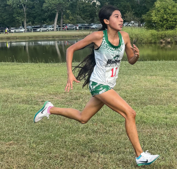 Freshman Jazmin Neri runs to the finish line in first place. Photo courtesy Addison Van Hooser.