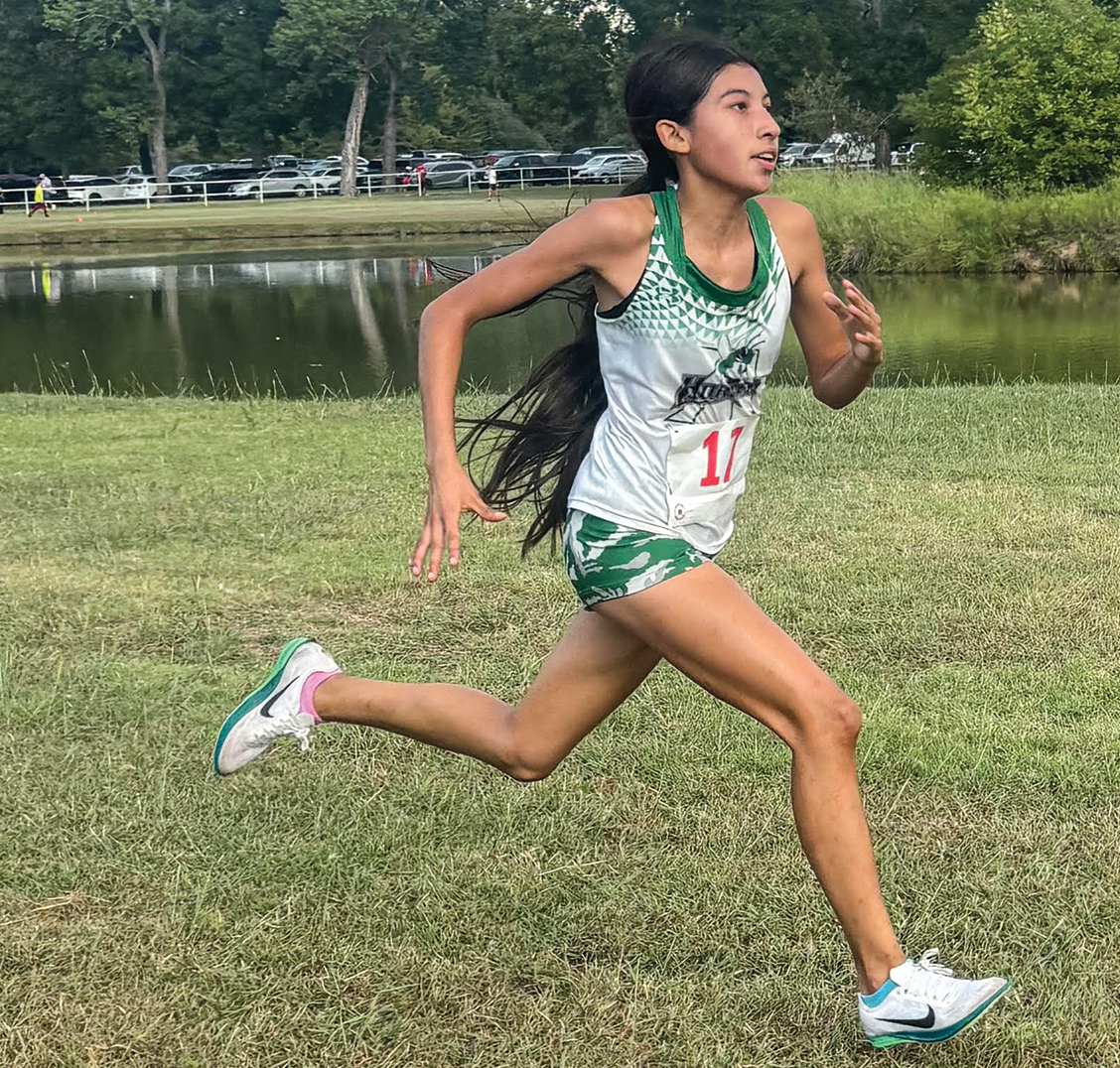 Freshman Jazmin Neri runs to the finish line in first place. Photo courtesy Addison Van Hooser.