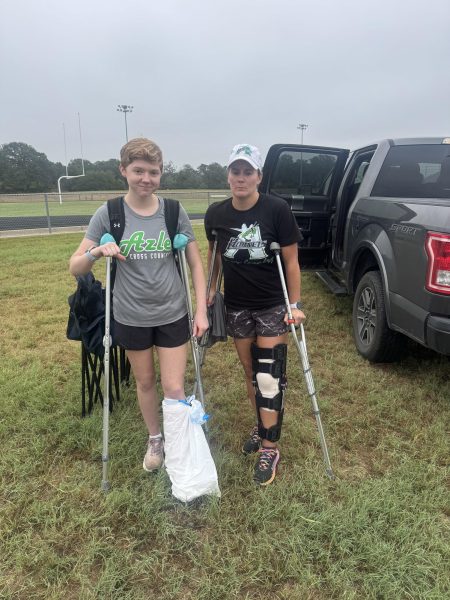 Senior Lily Hudman and coach Kelsie Jones sport similar injuries at the Aug. 29 cross country meet. Photo courtesy of Mason Schluter.