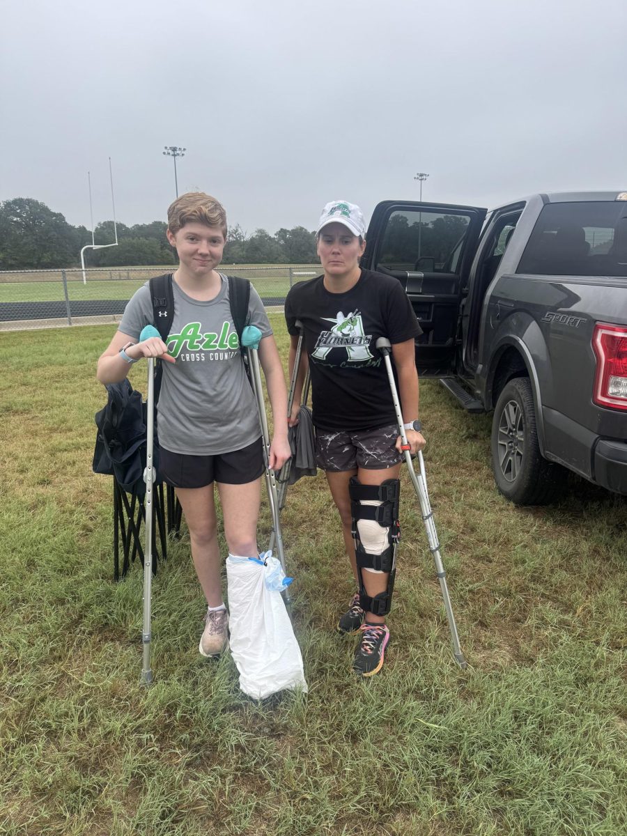 Senior Lily Hudman and coach Kelsie Jones sport similar injuries at the Aug. 29 cross country meet. Photo courtesy of Mason Schluter.