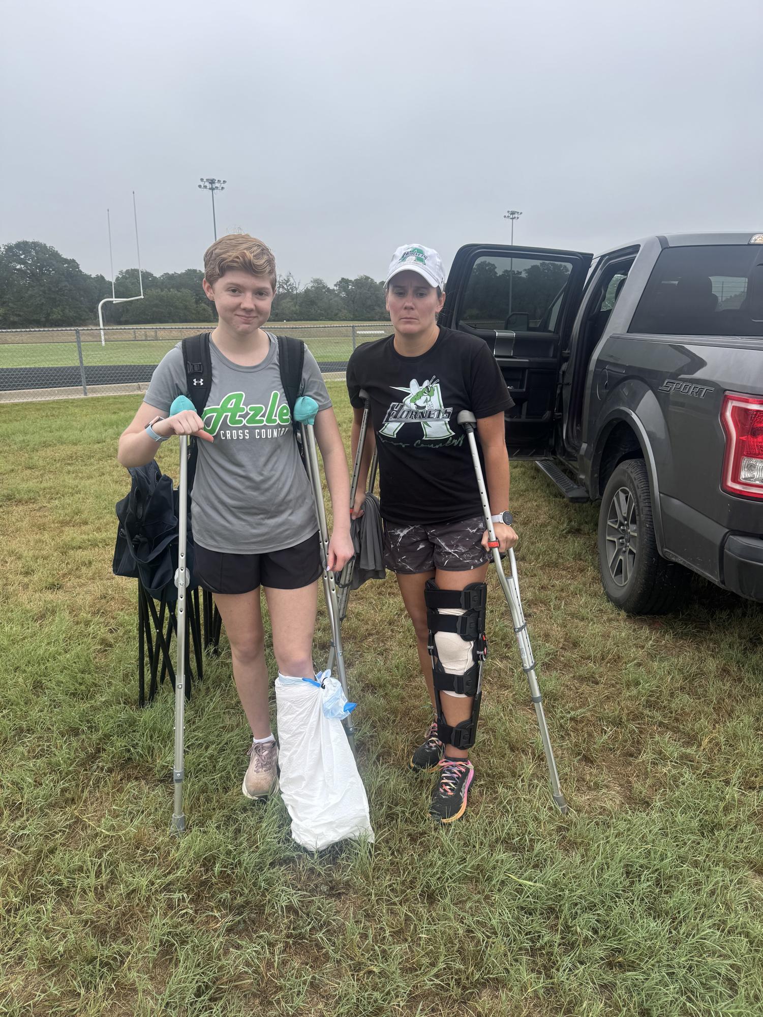 Senior Lily Hudman and coach Kelsie Jones sport similar injuries at the Aug. 29 cross country meet. Photo courtesy of Mason Schluter.