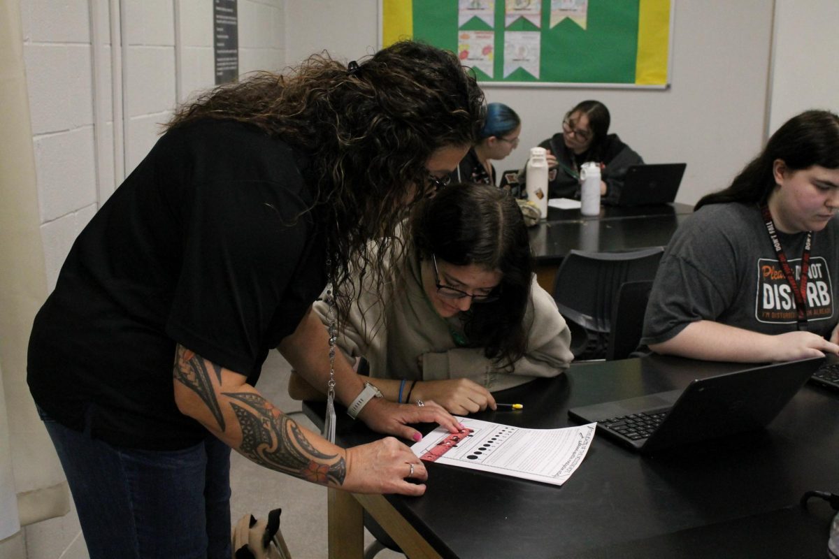 Forensic teacher and Criminal Justice Adviser Katherine Cruz prioritizes her students' learning by lending one-on-one support with work.