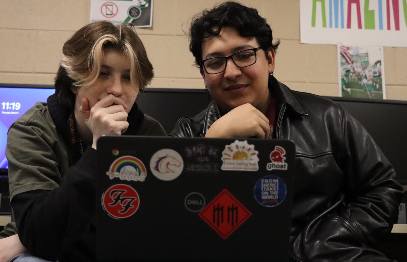 Junior Nick Allen (left) and Garcia (right) look at Garcia’s JAVA code on his Chromebook.
