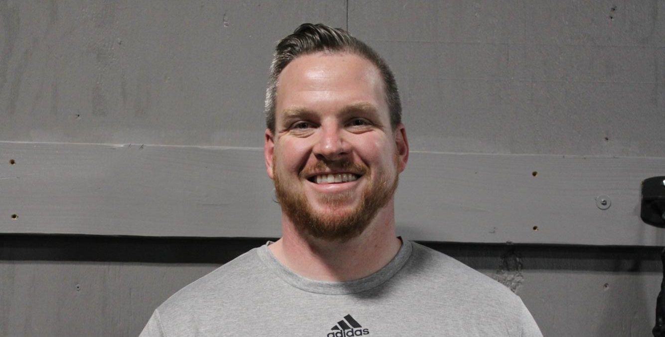 Wilson Rigg poses
for the camera in the weight room.