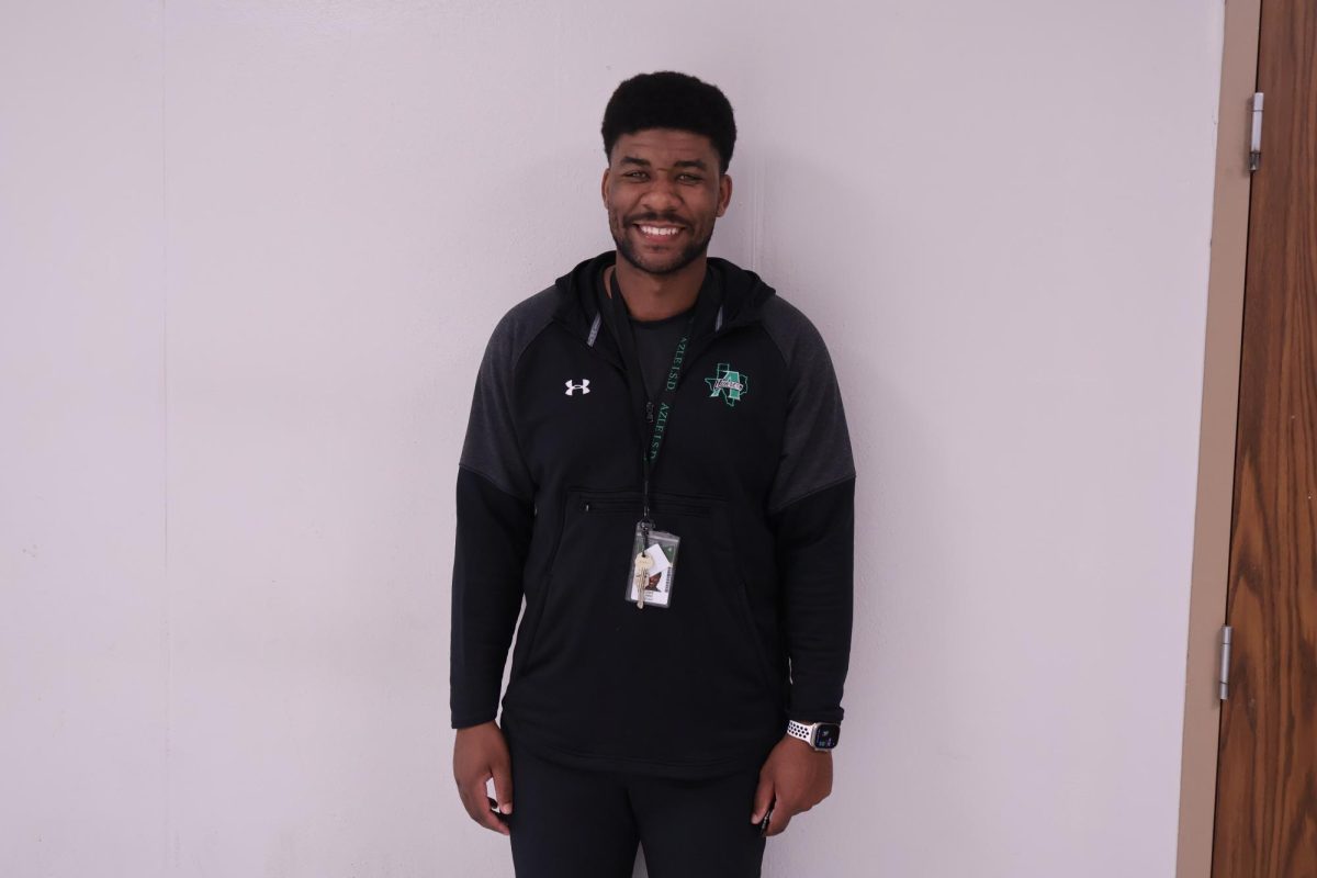 Coach King outside of his classroom in the F-Hall.