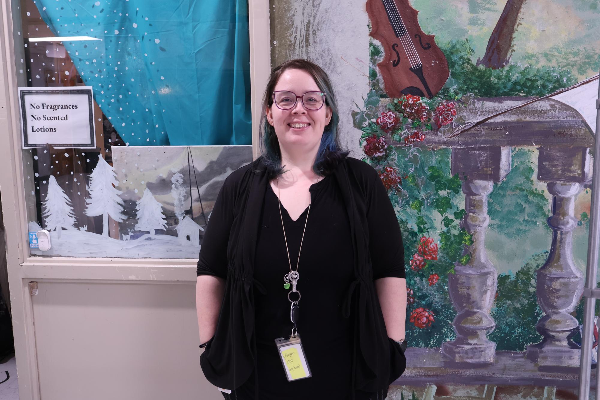 Ms. Bartee outside of her classroom in the H-Hall.