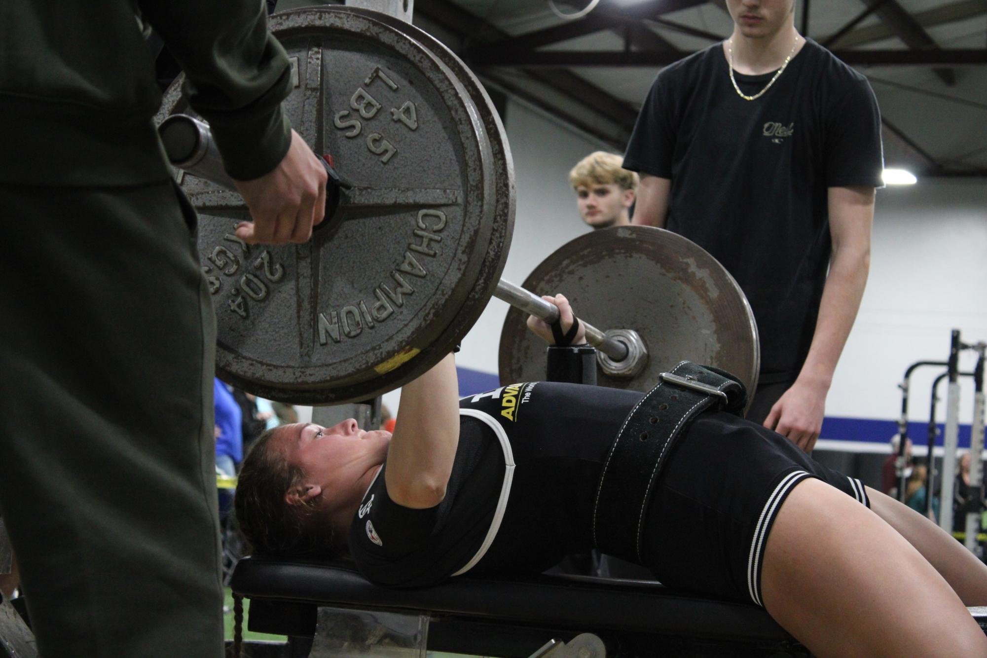At an invitational powerlifting meet at Brewer on Jan. 21, Donaldson drives through a 225-pound bench press.