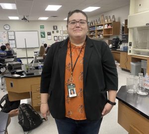 Ms. Reasoner posing for a picture during her 2nd period chem class.